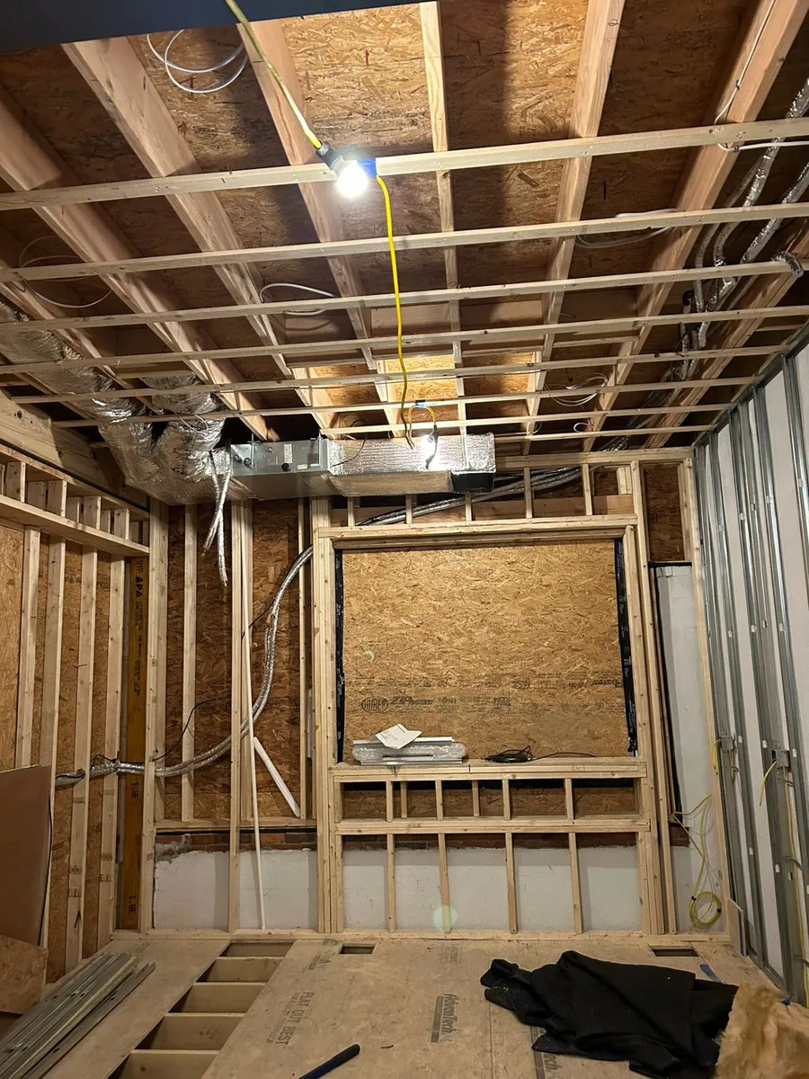 Air handler and ductwork during new home construction framing